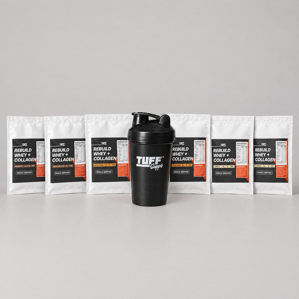 Six Rebuild Whey + Collagen sachets in Dutch Chocolate, Salted Caramel and Vanilla standing behind a black Tuff Supps shaker